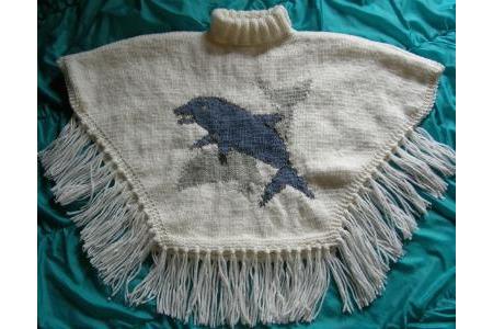 Poncho col roulé et franges