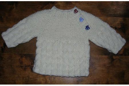 pull layette à torsades en irlandais